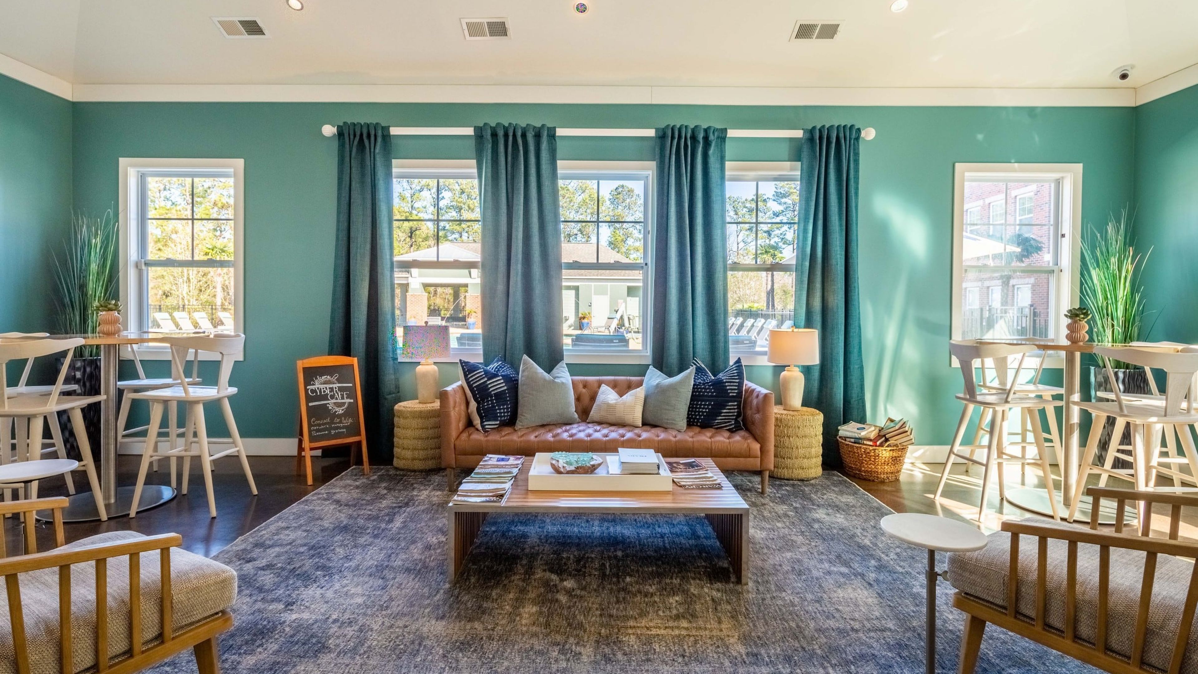 Hawthorne at the Station resident clubhouse amenity with seating area and beautiful finishes