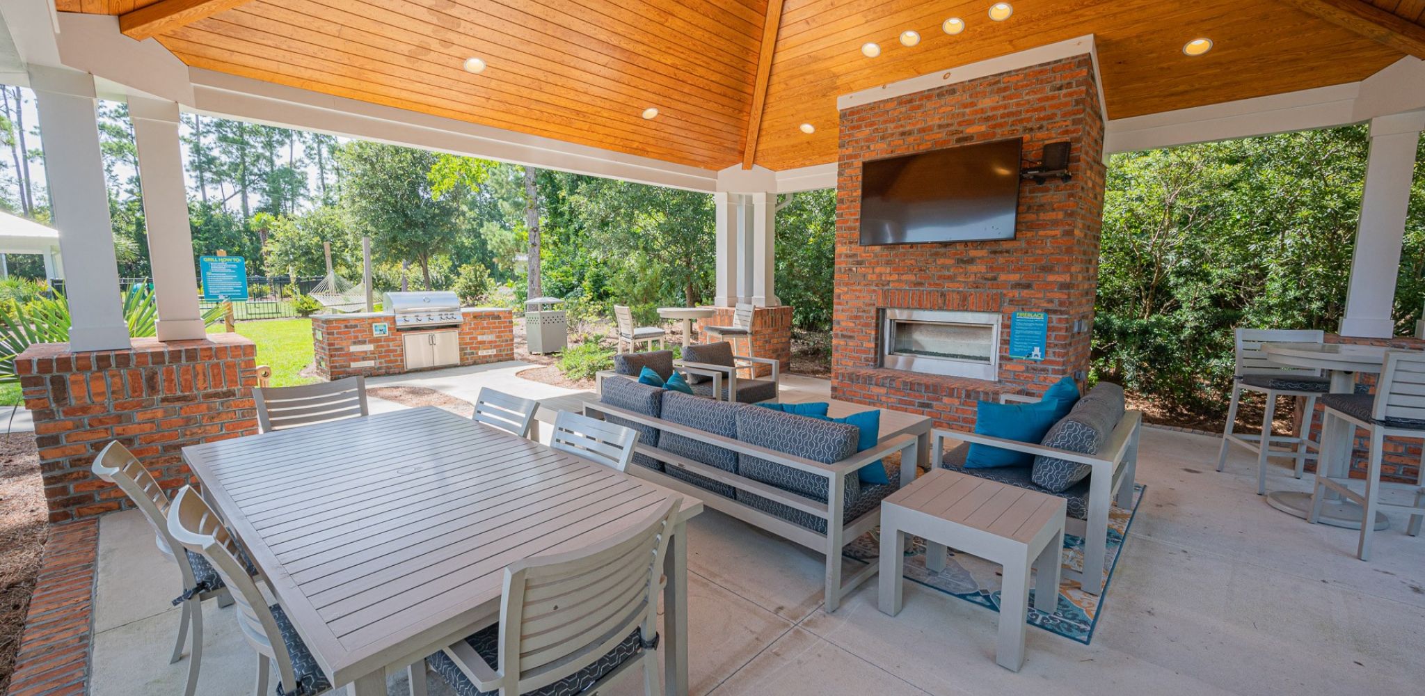 Hawthorne at the Station outdoor grilling space and gazebo with lounge seating and fireplace